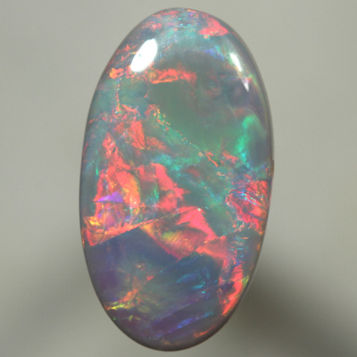 SOLID SEMI BLACK OPAL Top quality. Bright, strong fire in rolling flashes. SEE VIDEO